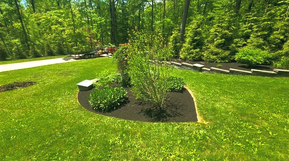 Spring Landscaping crew work — mulched island bed and freshly cut lawn in Mentor, Ohio